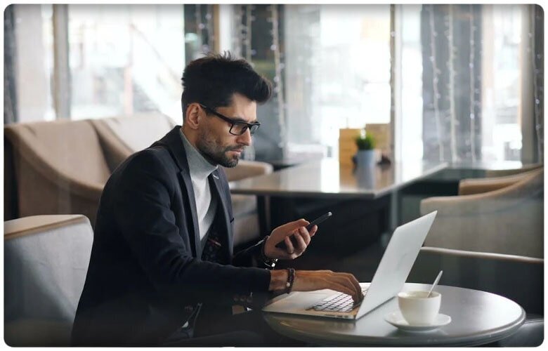 Person in front of a laptop talking