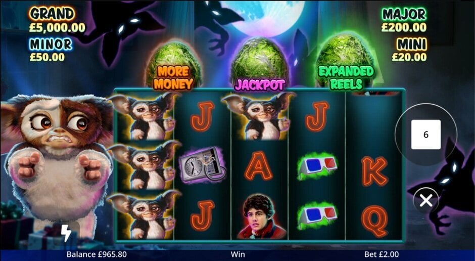 Gremlins After Midnight slot gameplay showing Gizmo, the reels and the More Money, Jackpot and Expanded Reels features