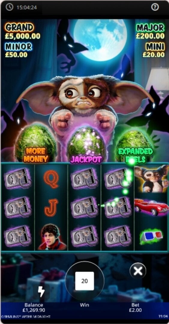 Gremlins After Midnight mobile gameplay showing Gizmo, the reels and the More Money, Jackpot and Expanded Reels features